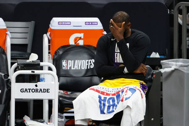 LeBron James of the Los Angeles Lakers reacts on the bench during the second half in Game Five of the Western Conference first-round playoff series...