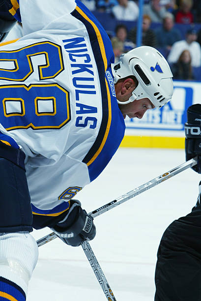 left-wing-eric-nickulas-of-the-st-louis-blues-faces-off-against-the-picture-id1469105
