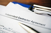 Legal document Independent Contractor Agreement on paper close up