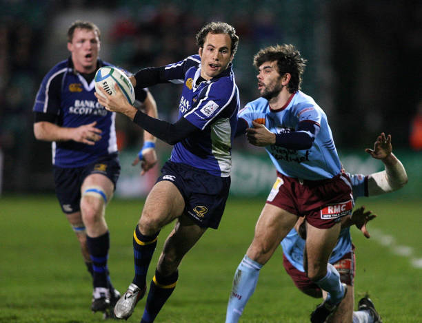 Leinster's Girvan Dempsey (C) evades the challenge from Bourgoin's Alexandre Peclier during the Heineken Cup match at the Royal Dublin Society Stadium, Leinster, Dublin, Ireland, Saturday December 10, 2005. PRESS ASSOCIATION Photo. Photo credit should read: Julien Behal/PA. (Photo by Julien Behal - PA Images/PA Images via Getty Images)