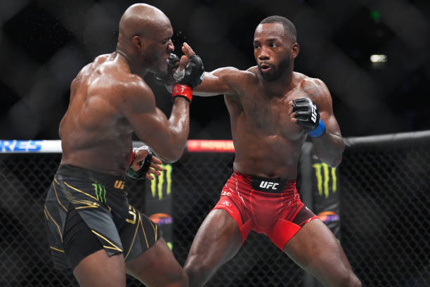 Leon Edwards of Jamaica punches Kamaru Usman of Nigeria in the UFC welterweight championship fight during the UFC 278 event at Vivint Arena on August...