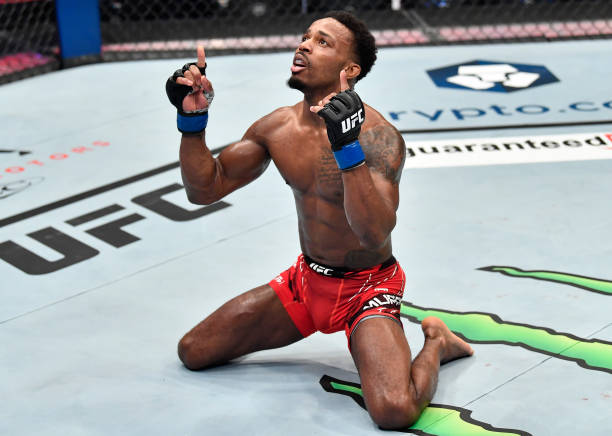 Lerone Murphy of England celebrates after his knockout victory over Makwan Amirkhani of Finland in a featherweight fight during the UFC 267 event at...