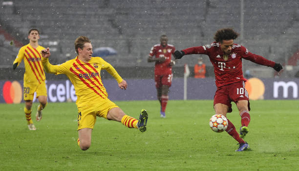 Leroy Sané of Muenchen shots past Frenkie de Jong of Barcelona as he scores the second goal during the UEFA Champions League group E match between FC...
