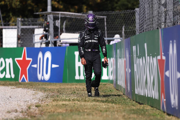 Lewis Hamilton of Great Britain and Mercedes GP walks back to the pits after crashing during the F1 Grand Prix of Italy at Autodromo di Monza on...