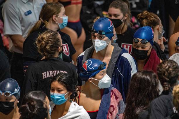 Lia Thomas, a transgender woman , gathers with her teammates before she swims for the University of Pennsylvania at an Ivy League swim meet against...