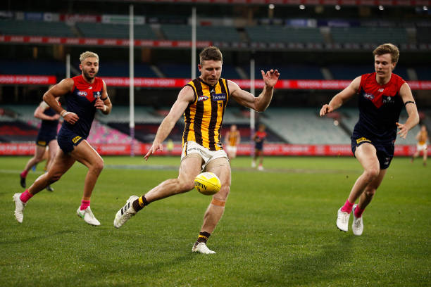 Liam Shiels of the Hawks kicks the ball during the round 18 AFL match between Melbourne Demons and Hawthorn Hawks at Melbourne Cricket Ground on July...