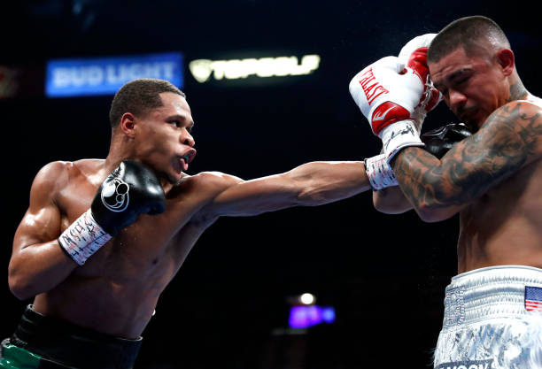 Lightweight champion Devin Haney punches Joseph Diaz Jr. In a title fight at MGM Grand Garden Arena on December 04, 2021 in Las Vegas, Nevada. Haney...