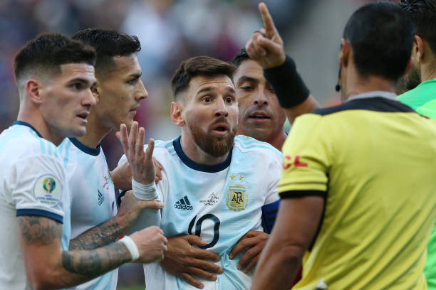 Lionel Messi of Argentina argues with Referee Mario Diaz de Vivar after being shown the red card during the Copa America Brazil 2019 Third Place...