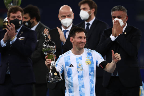 Lionel Messi of Argentina celebrates after receiving the top scorer award as President of CONMEBOL Alejandro Dominguez, President of FIFA Gianni...