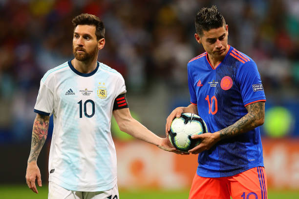Lionel Messi of Argentina hands the ball to James Rodriguez of Colombia during the Copa America Brazil 2019 group B match between Argentina and...