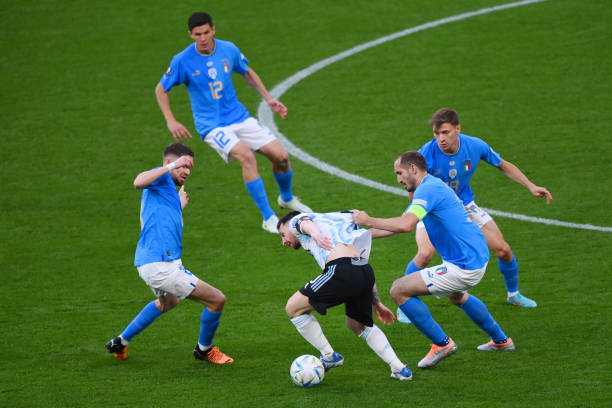 Lionel Messi of Argentina is challenged by Jorginho and Giorgio Chiellini of Italy during the 2022 Finalissima match between Italy and Argentina at...
