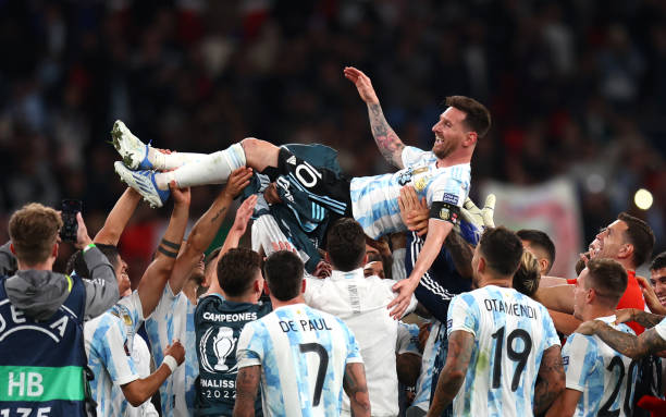Lionel Messi of Argentina is thrown in the air by their teammates as they celebrate their sides victory in the 2022 Finalissima match between Italy...
