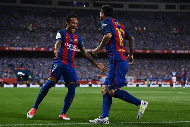 Lionel Messi of FC Barcelona celebrates with his team mate Neymar Jr. After scoring his team's first goal during the Copa Del Rey Final between FC...