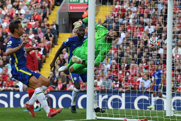 Liverpool's Brazilian goalkeeper Alisson Becker cannot reach the ball as a header from Chelsea's German midfielder Kai Havertz opens the scoring in...