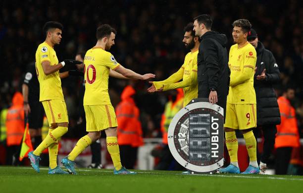 Liverpool's Colombian midfielder Luis Diaz and Liverpool's Portuguese striker Diogo Jota leaves the pitch after being substituted off for Liverpool's...