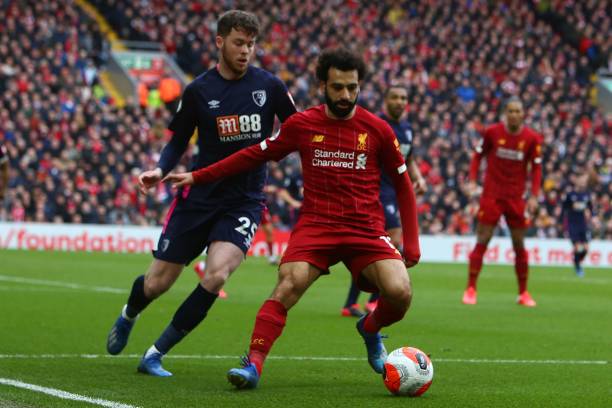 Liverpool's Egyptian midfielder Mohamed Salah vies with Bournemouth's English defender Jack Simpson during the English Premier League football match...