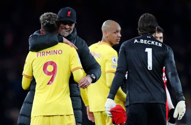 Liverpool's German manager Jurgen Klopp huggs Liverpool's Brazilian midfielder Roberto Firmino after the English Premier League football match...