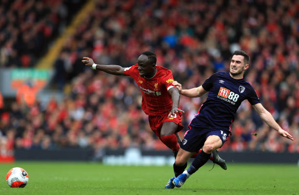 Liverpool's Sadio Mane and Bournemouth's Lewis Cook battle for the ball during the Premier League match at Anfield Liverpool