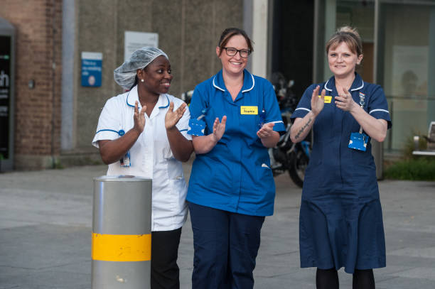 Local residents, NHS staff and police officers applaud key workers at North Middlesex Hospital on May 7, 2020 in London, United Kingdom. Following...