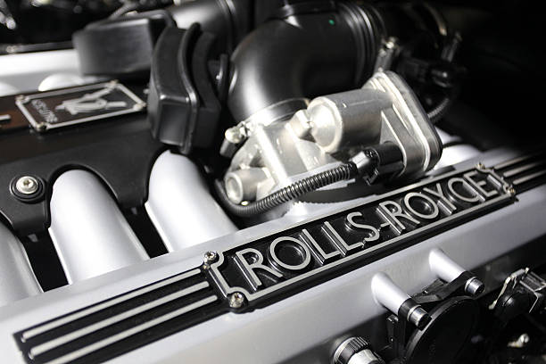 logo sits on a rocker cover inside the engine bay of a rollsroyce picture