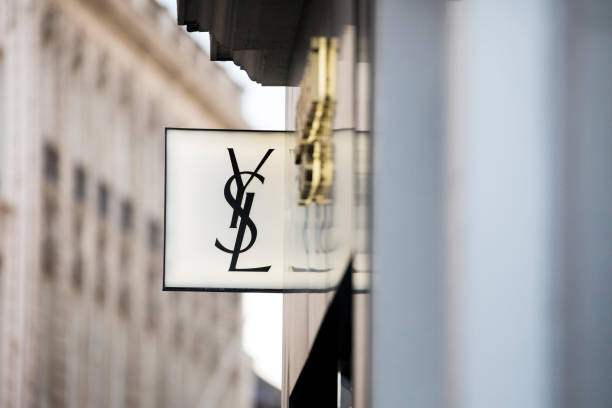 logo sits outside a yves saint laurent sa luxury clothing fashion on picture