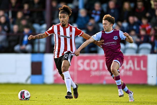 Louth , Ireland - 24 October 2021; Bastien Hery of Derry City in action against Darragh Markey of Drogheda United during the SSE Airtricity League...