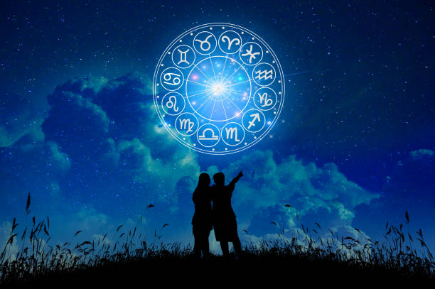 lovers stand in the stars zodiac signs inside of horoscope circle. astrology in the sky with many stars and moons  astrology and horoscopes concept - astrologia - fotografias e filmes do acervo