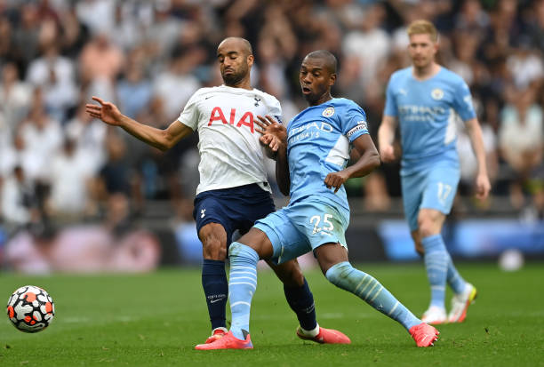 Lucas Moura of Tottenham Hotspur is challenged by Fernandinho of Manchester City during the Premier League match between Tottenham Hotspur and...