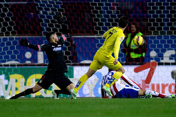 Luciano Dario Vietto of Villarreal CF scores their opening goal during the La Liga match between Club Atletico de Madrid and Villarreal CF at Vicente...