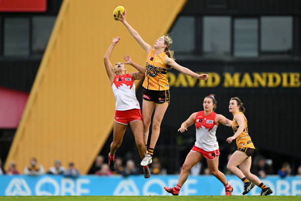 Lucy Wales of the Hawks and Cynthia Hamilton of the Swans compete in the ruck during the round five AFLW match between the Sydney Swans and the...