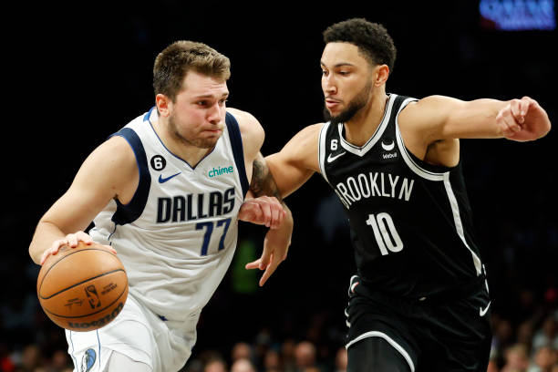 Luka Doncic of the Dallas Mavericks dribbles against Ben Simmons of the Brooklyn Nets during the second half at Barclays Center on October 27, 2022...