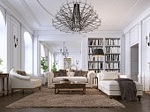 Luxury classic interior of living room and dining room with white furniture and metal chandeliers.