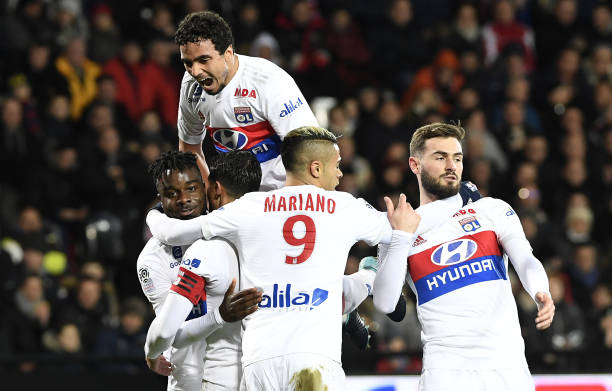 Lyon's players jubilate after scoring during the French L1 football match Guingamp against Lyon January 17, 2018 at the Roudourou stadium in Guingamp, western France. /