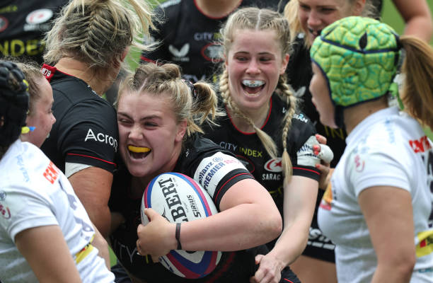 Mackenzie Carson of Saracens celebrates with team mates after scoring her teams fourth try during the Allianz Premier 15s Final match between...