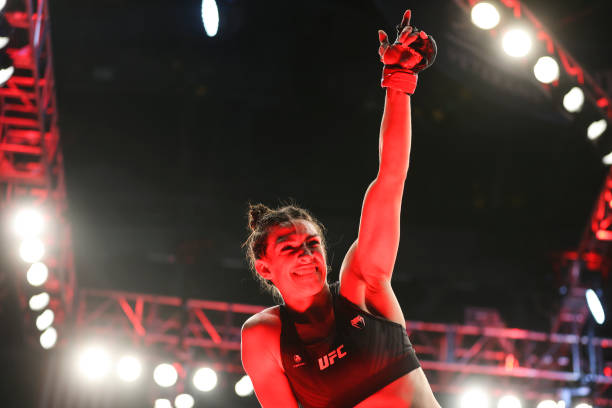 Mackenzie Dern reacts after her victory over Tecia Torres in their strawweight fight during the UFC 273 event at VyStar Veterans Memorial Arena on...