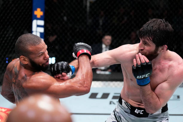 Magomed Ankalaev of Russia punches Thiago Santos of Brazil in their light heavyweight fight during the UFC Fight Night event at UFC APEX on March 12,...