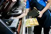 Making burgers from cutlets and shelves at McDonald's