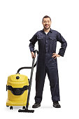Male janitor with a professional hoover