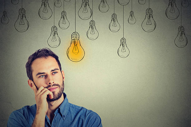 man looking up with idea light bulb above head