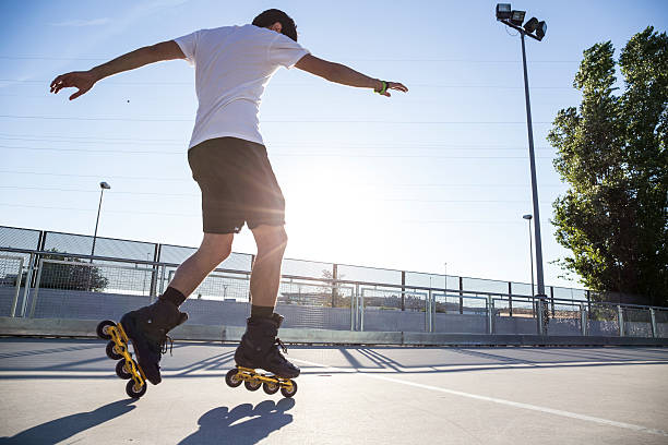 man with rollerblades during a skating session - roller blades stock pictures, royalty-free photos & images