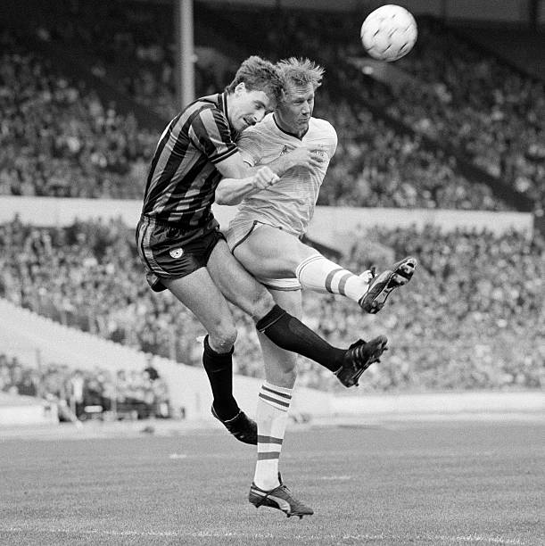 Manchester City defender Mick McCarthy and Doug Rougvie of Chelsea clash during the Full Members Cup Final at Wembley Stadium, 23rd March 1986....