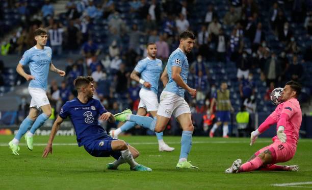 Manchester City's Brazilian goalkeeper Ederson makes a save as Chelsea's American midfielder Christian Pulisic attempted a shot at goal during the...