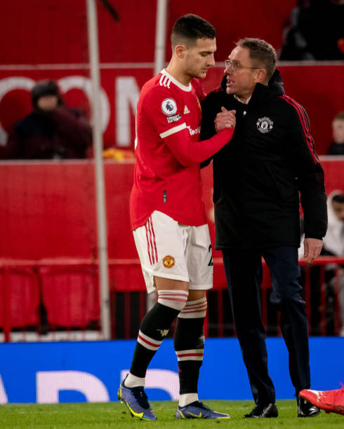 Manchester United Head Coach / Manager Ralf Rangnick congratulates Diogo Dalot of Manchester United at the end of the Premier League match between...