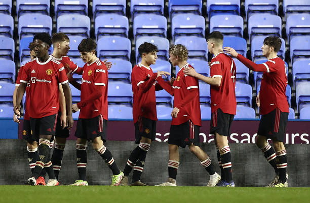 Manchester United u18s celebrate after Sam Mather of Manchester United u18s scored his teams second goal during the FA Youth Cup match between...