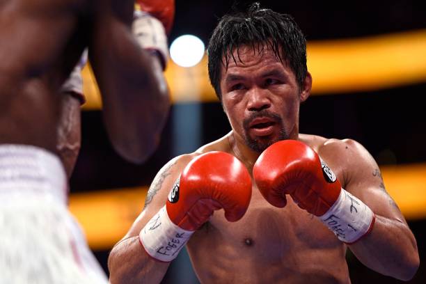 Manny Pacquiao of the Philippines fights against Yordenis Ugas of Cuba during the WBA Welterweight Championship boxing match at T-Mobile Arena in Las...