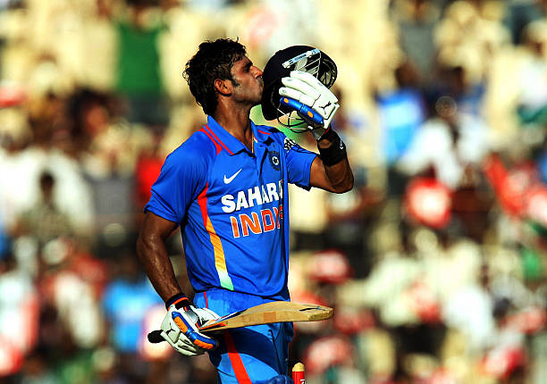 Manoj Tiwary of India kisses his helmet after reaching his half-century during the 5th One Day International between India and West Indies at the...