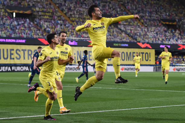 Manu Trigueros of Villarreal celebrates with teammates Gerard Moreno and Alfonso Pedraza after scoring their team's first goal during the UEFA Europa...