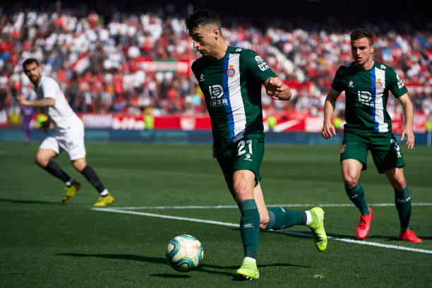 Marc Roca of Espanyol runs with the ball during the Liga match between Sevilla FC and RCD Espanyol at Estadio Ramon Sanchez Pizjuan on February 16...