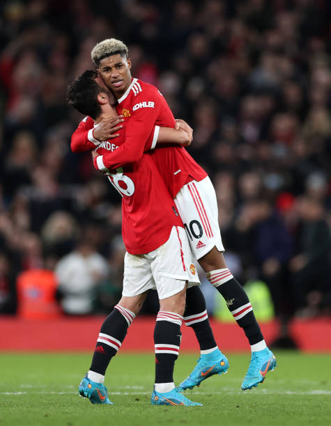 Marcus Rashford embraces Bruno Fernandes of Manchester United after their sides victory during the Premier League match between Manchester United and...