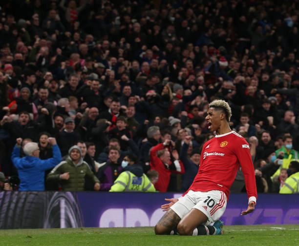 Marcus Rashford of Manchester United celebrates scoring their first goal during the Premier League match between Manchester United and West Ham...